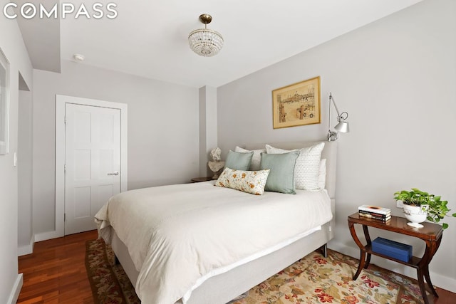 bedroom featuring dark hardwood / wood-style flooring