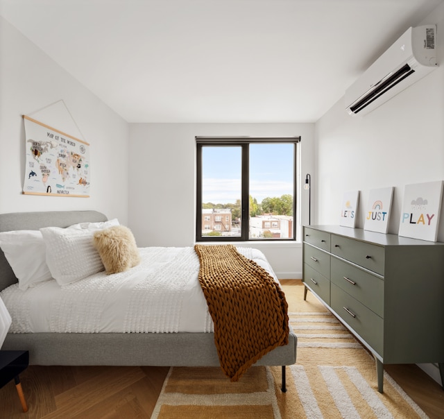 bedroom with an AC wall unit