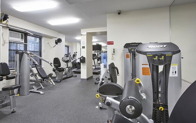 gym featuring an AC wall unit