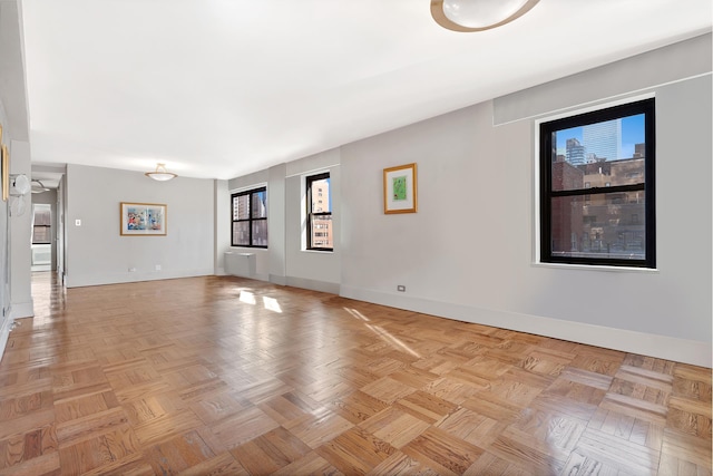 empty room featuring baseboards