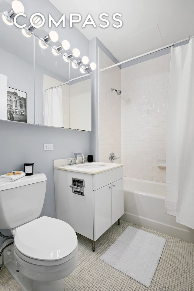 bathroom with shower / bath combo, vanity, and toilet