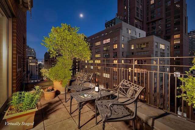 patio at twilight with a balcony