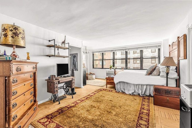 bedroom with light parquet flooring