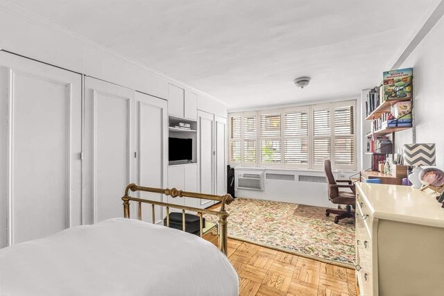 bedroom featuring light parquet flooring