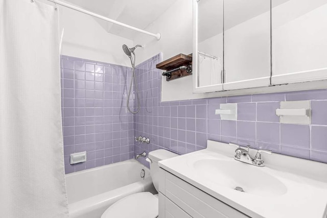 209 E 56th St Unit 5Abc, New York City, NY 10022 - bathroom featuring shower / bath combo, tasteful backsplash, tile walls, toilet, and vanity