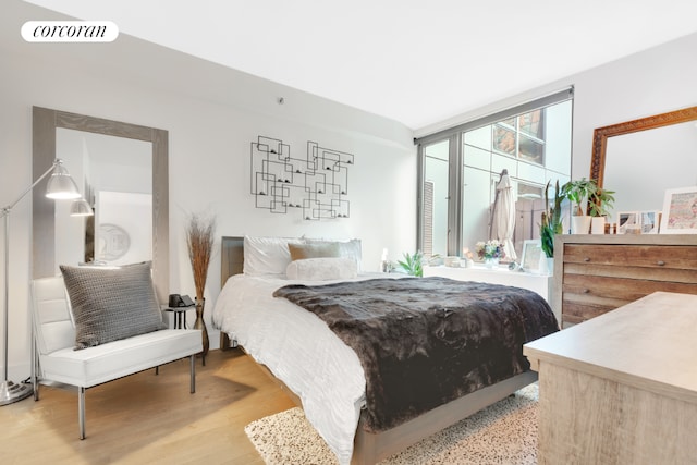 bedroom with light hardwood / wood-style flooring