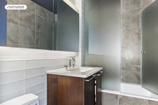 full bathroom featuring vanity, toilet, and bathing tub / shower combination