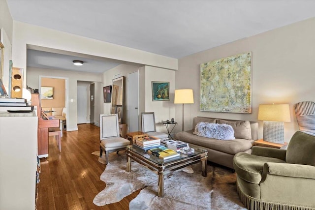 living room with dark hardwood / wood-style flooring