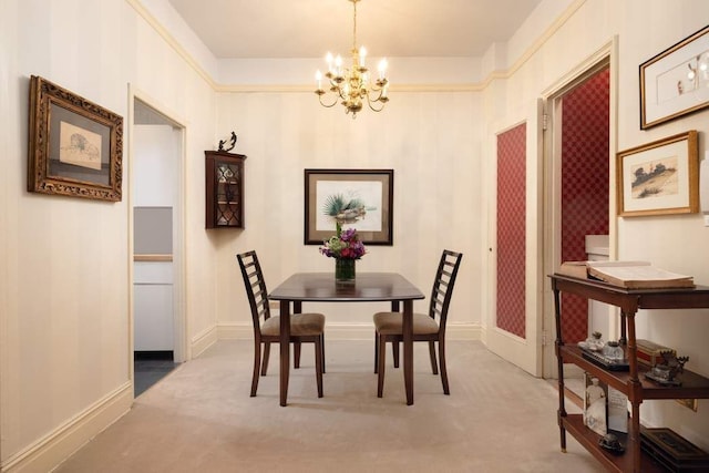 dining room with light carpet and a notable chandelier