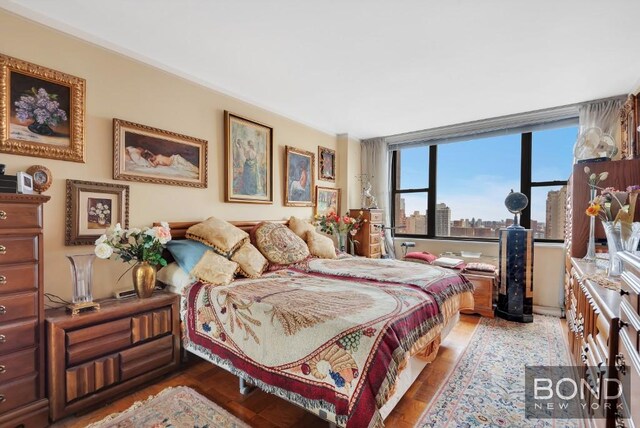 bedroom featuring wood-type flooring