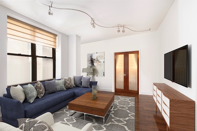 living room with dark hardwood / wood-style flooring and french doors