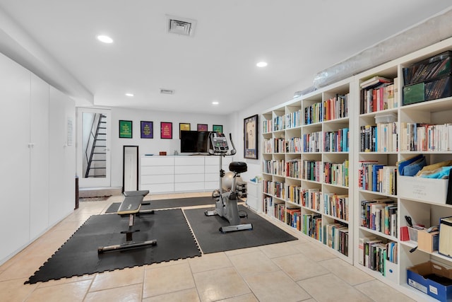 exercise area featuring recessed lighting, visible vents, and tile patterned floors