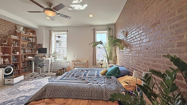 bedroom with ceiling fan, brick wall, and recessed lighting