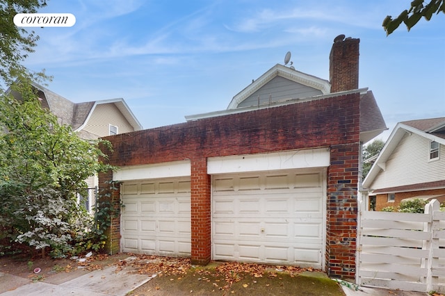 garage with fence