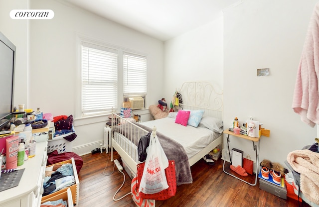 bedroom featuring dark hardwood / wood-style floors