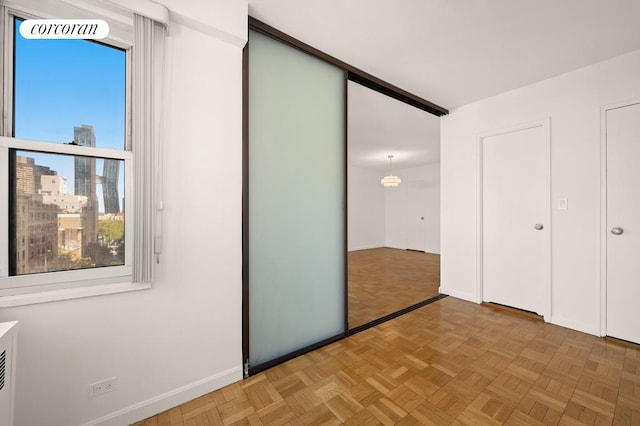 unfurnished bedroom featuring light parquet floors