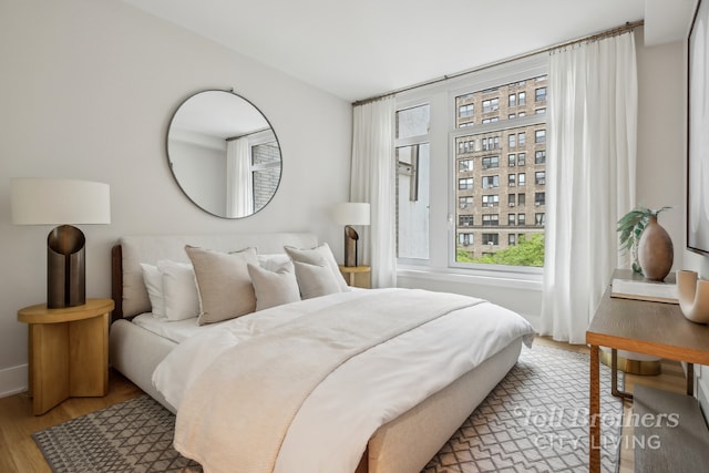 bedroom with light hardwood / wood-style flooring