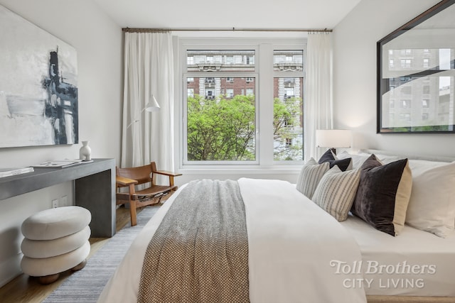 bedroom with wood-type flooring