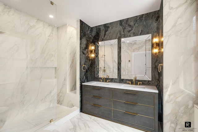 full bath featuring stone wall, tile walls, marble finish floor, and a sink