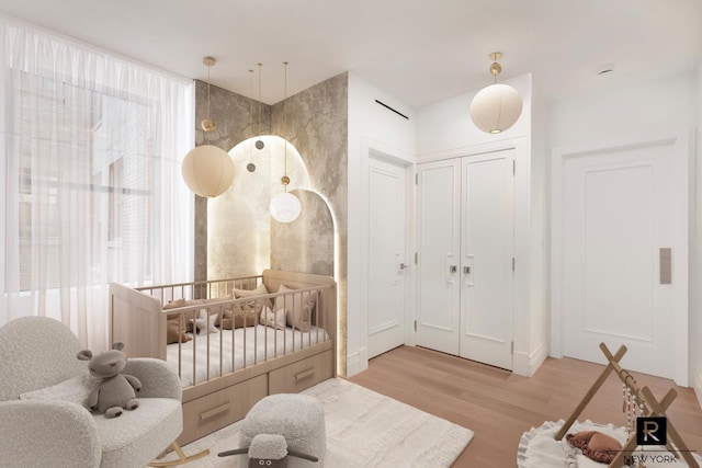 171 W 57th St Unit 6-B, New York City, NY 10019 - bedroom with light wood-type flooring