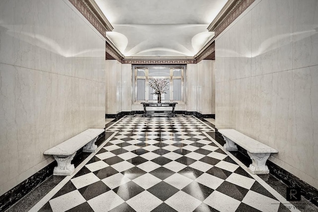 171 W 57th St Unit 6-B, New York City, NY 10019 - hallway featuring inlaid floor details and a tray ceiling