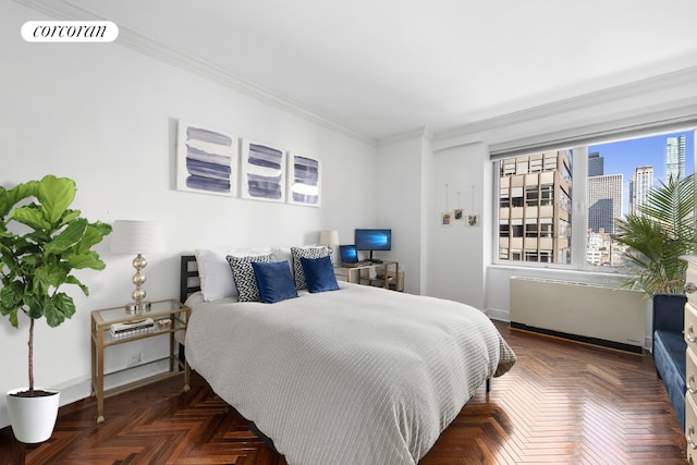 bedroom featuring dark parquet floors and crown molding