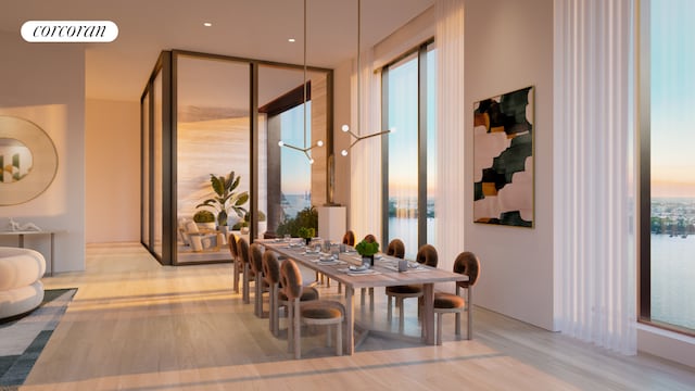 dining area with visible vents, floor to ceiling windows, and wood finished floors