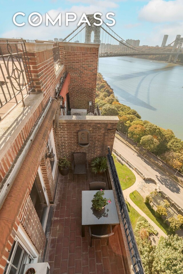 balcony featuring a water view