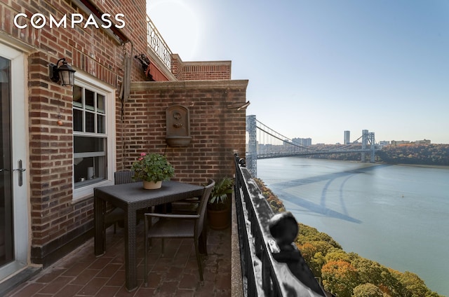 balcony with a city view and a water view