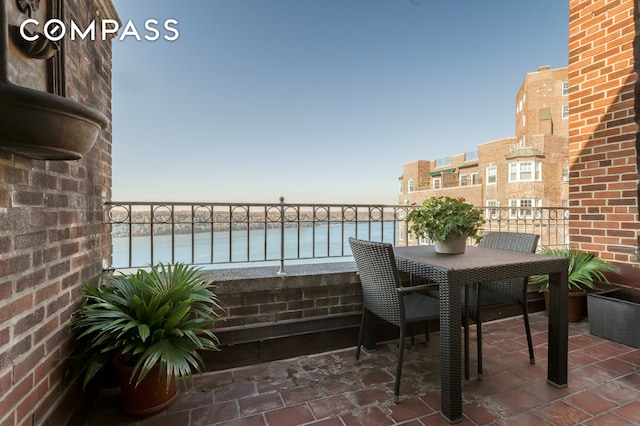 balcony featuring a water view