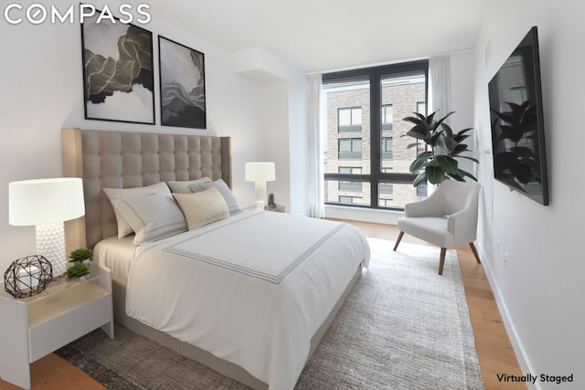 bedroom featuring hardwood / wood-style flooring