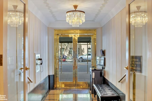 interior space with an inviting chandelier and french doors