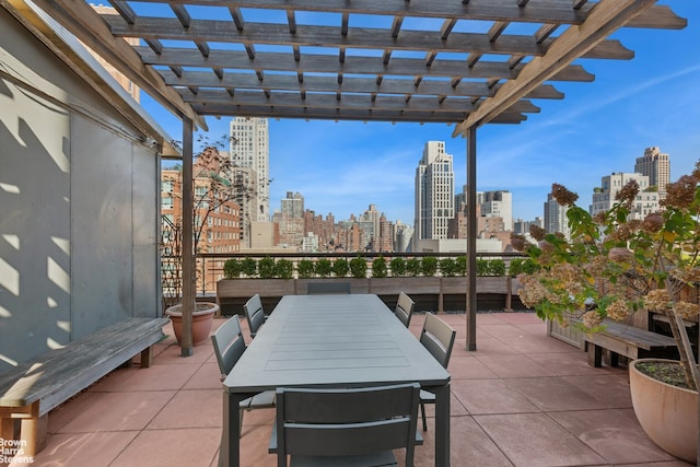 215 E 79th St Unit 6F, New York City, NY 10075 - view of patio featuring a view of skyline, a pergola, and outdoor dining area