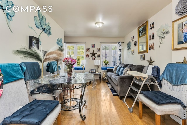 living room with french doors and hardwood / wood-style floors