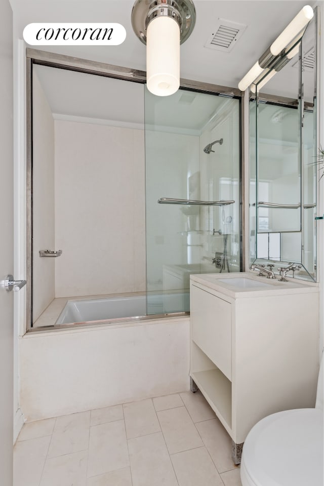 full bath featuring tile patterned flooring, toilet, vanity, visible vents, and combined bath / shower with glass door