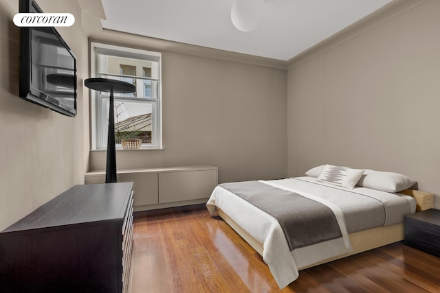 bedroom with wood finished floors