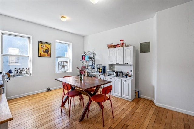 dining area featuring a healthy amount of sunlight and light hardwood / wood-style floors