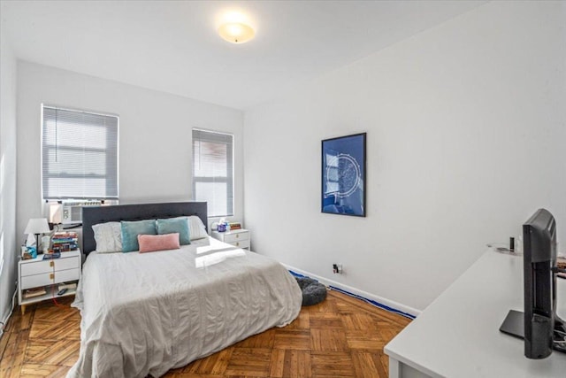 bedroom featuring cooling unit and parquet floors