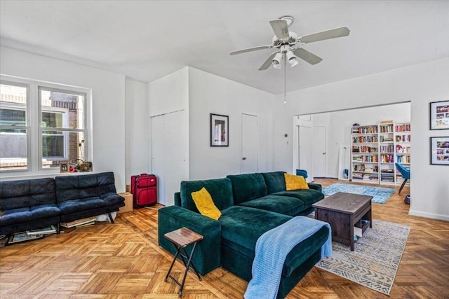 living room with light parquet flooring and ceiling fan