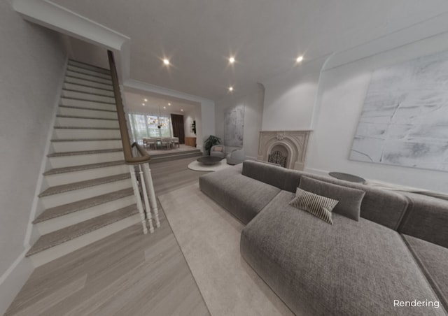 living area featuring stairway, a fireplace, wood finished floors, and recessed lighting