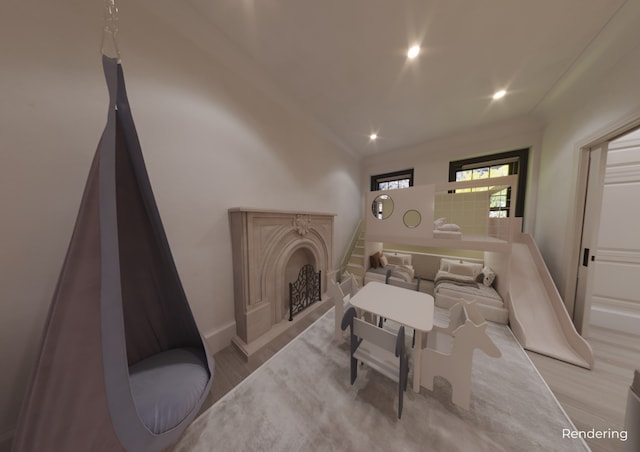 living area featuring baseboards, recessed lighting, and wood finished floors