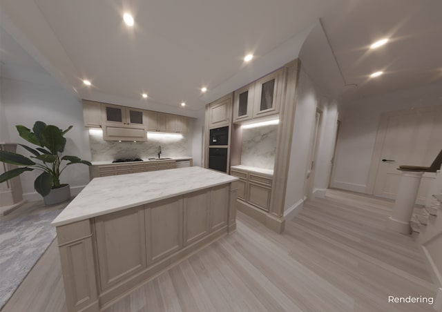 kitchen featuring backsplash, a center island, a sink, black appliances, and recessed lighting