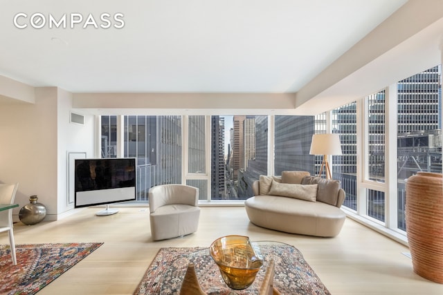 135 W 52nd St Unit 23C, New York City, NY 10019 - living area with wood finished floors