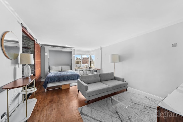 bedroom featuring crown molding and dark wood-type flooring