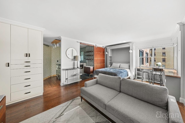 bedroom with crown molding and dark hardwood / wood-style floors