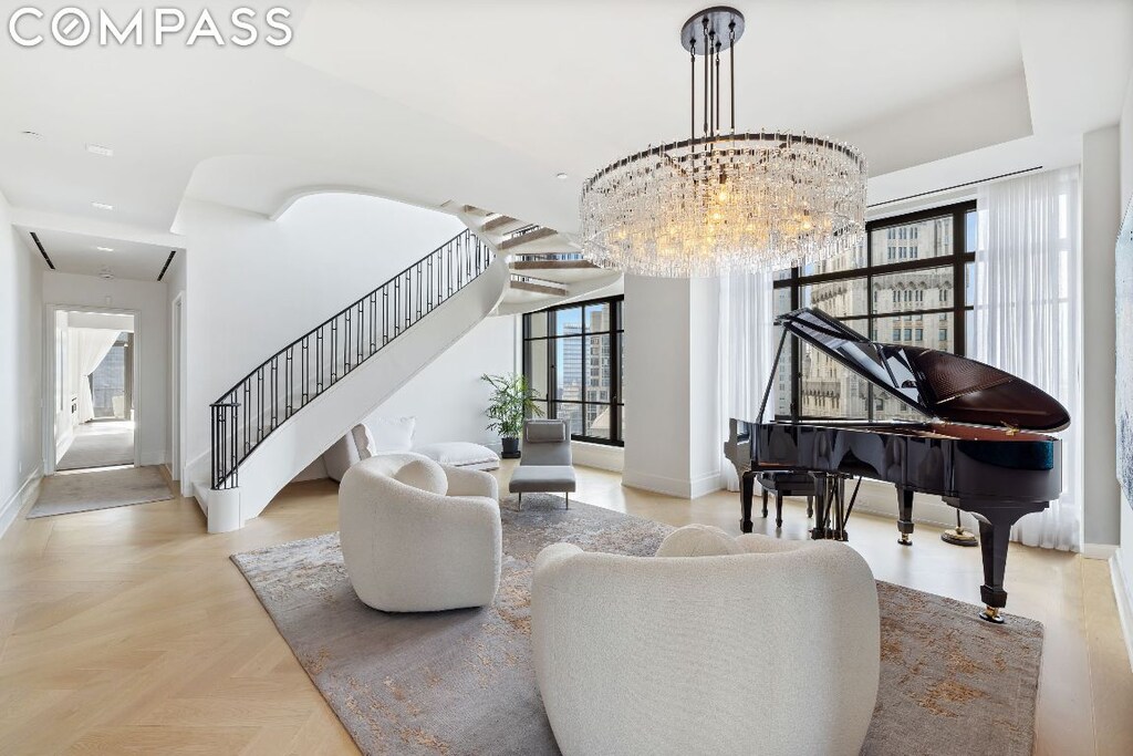 living area with light parquet floors and a healthy amount of sunlight