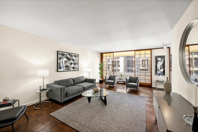 living room with dark parquet floors