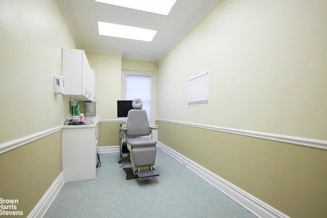 home office with ornamental molding and a skylight