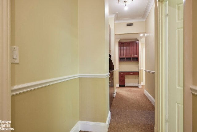 home office with ornamental molding and a skylight