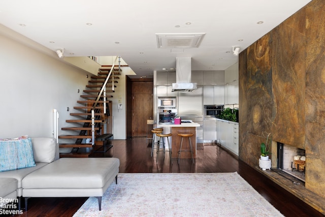 living room with dark hardwood / wood-style floors